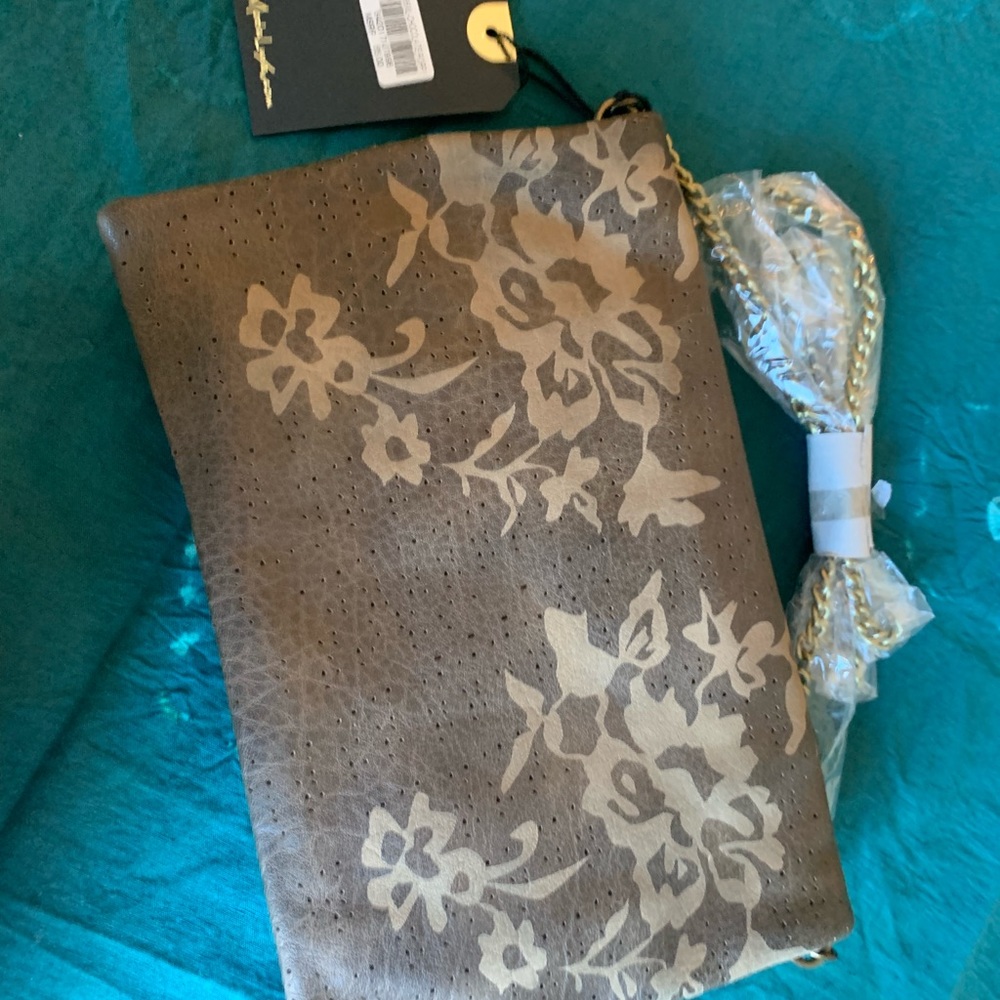 NWT Moda Luxe crossbody purse. Brown and gold. Flower boho print.